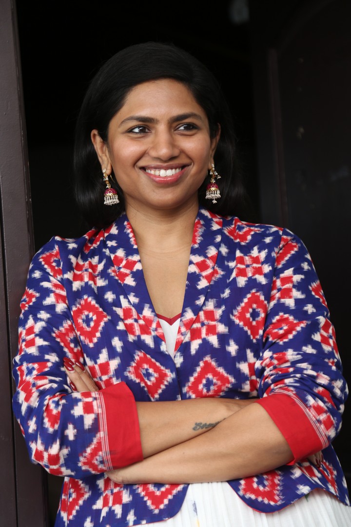 Neeraja Kona’s vibrant style brightens any room with confident smile