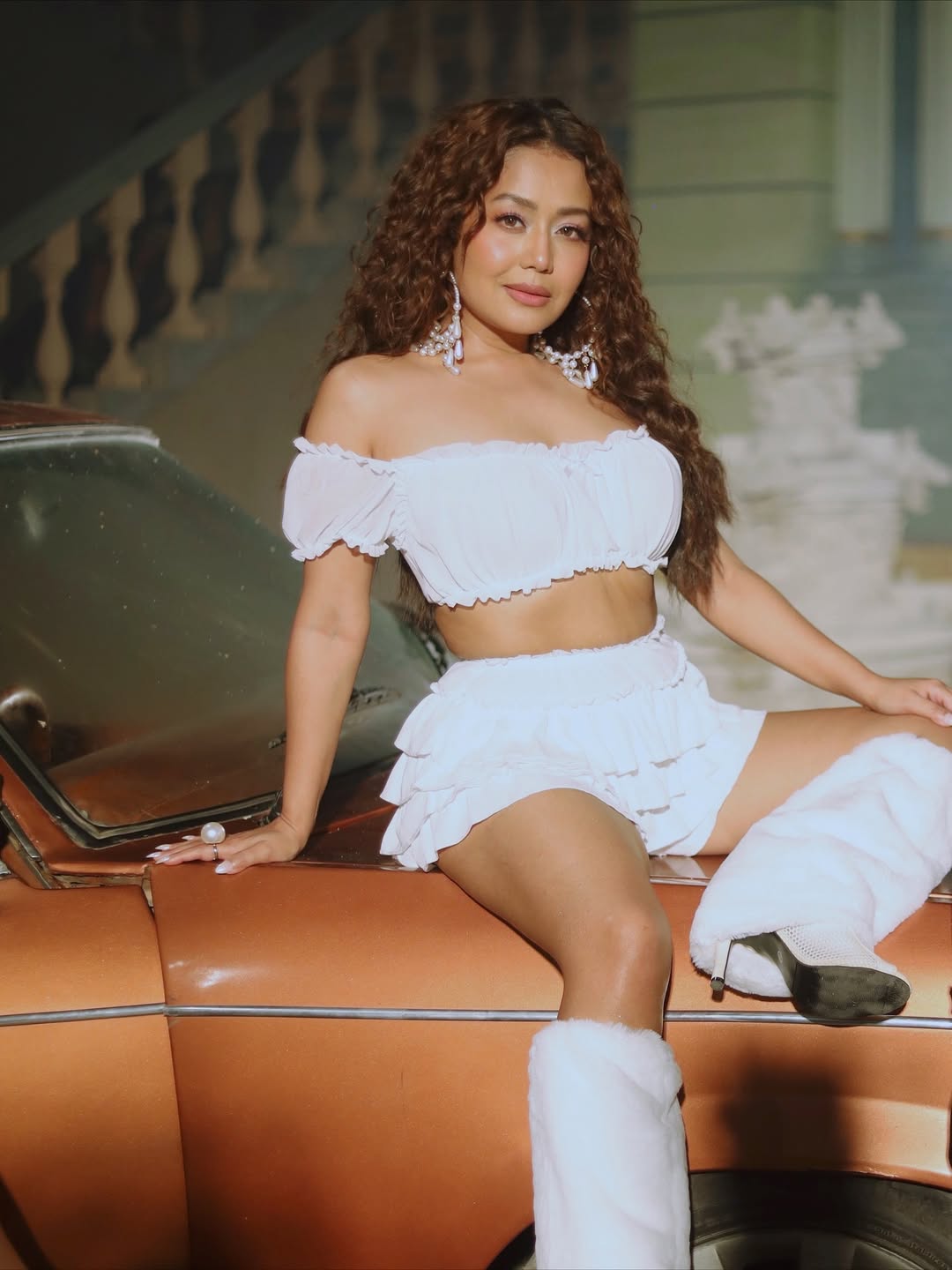 Neha Kakkar shines in white dress with bold attitude