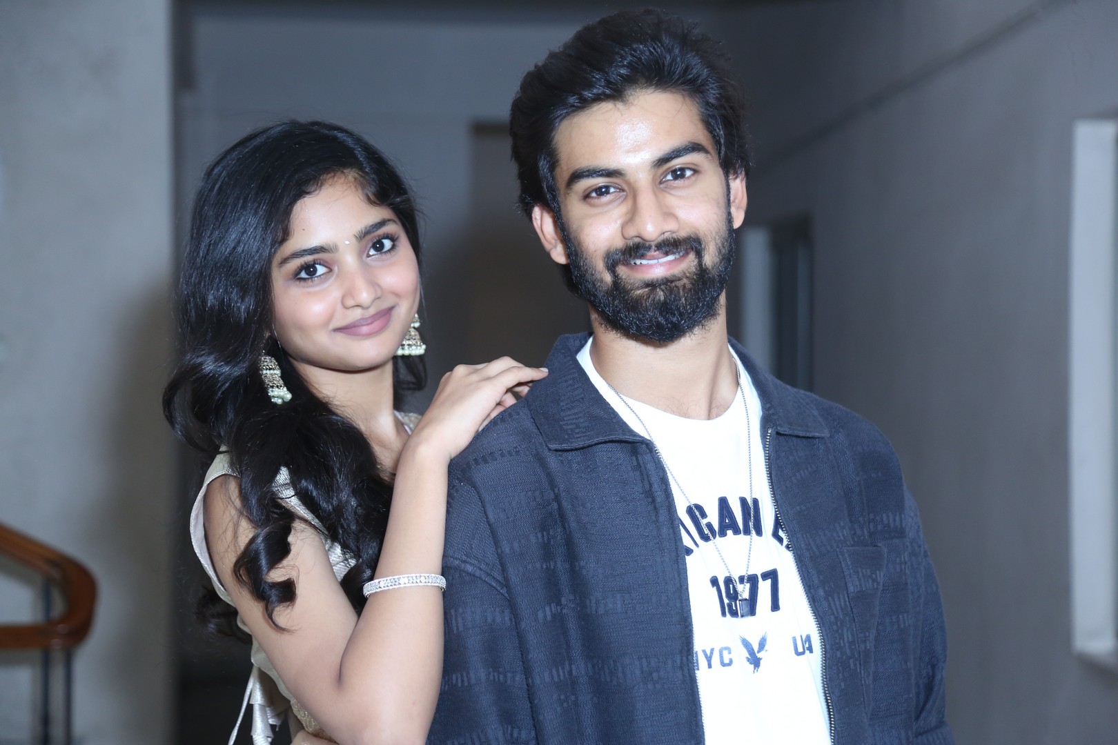 Preeti Neha and Sathvik Varma posing together for photographers