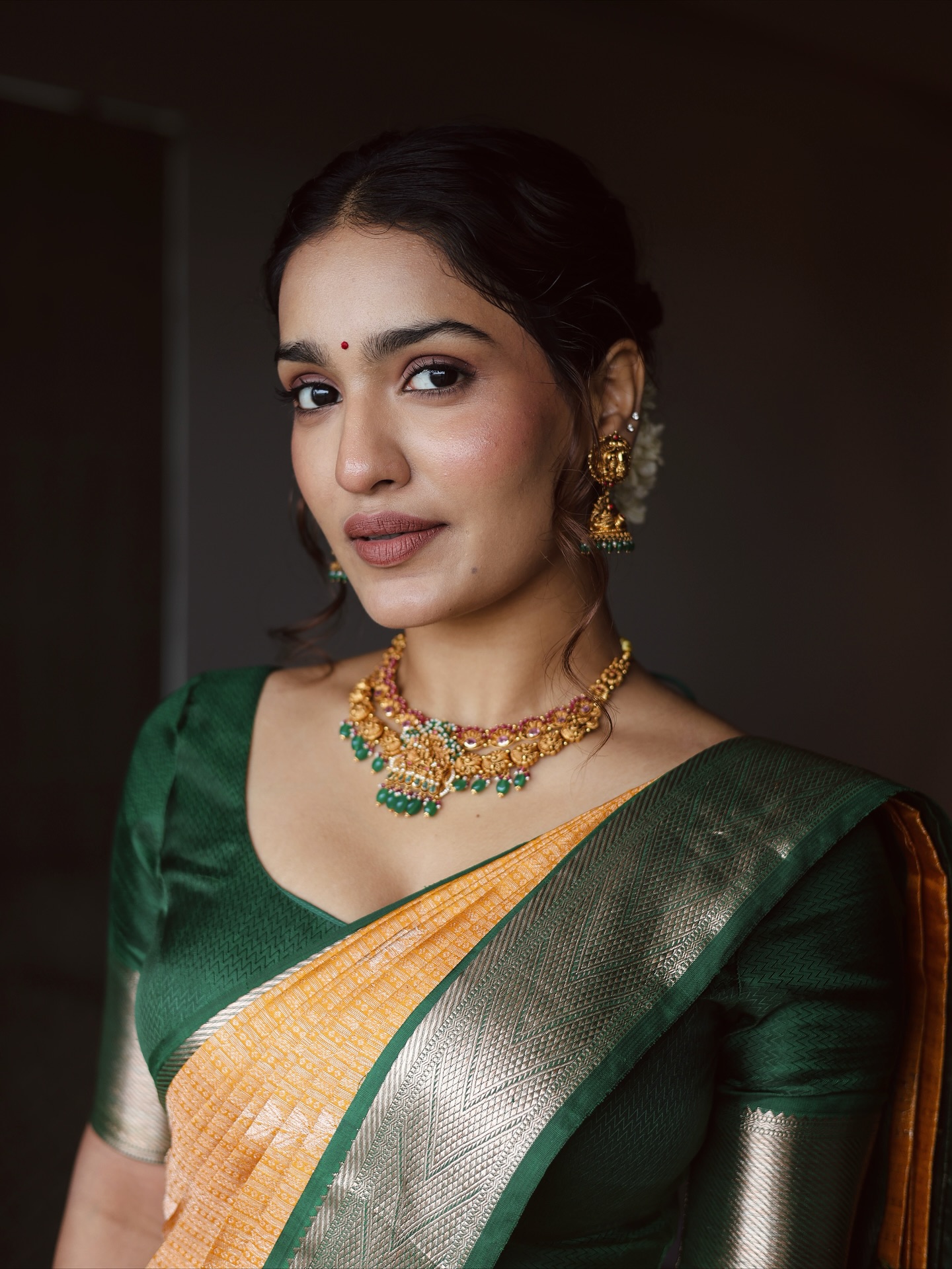 Saniya Iyappan radiating elegance in traditional green saree