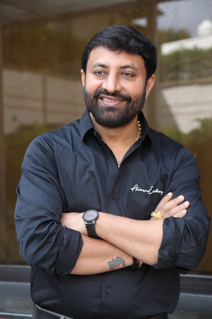 Satish looks sharp in black shirt and smile