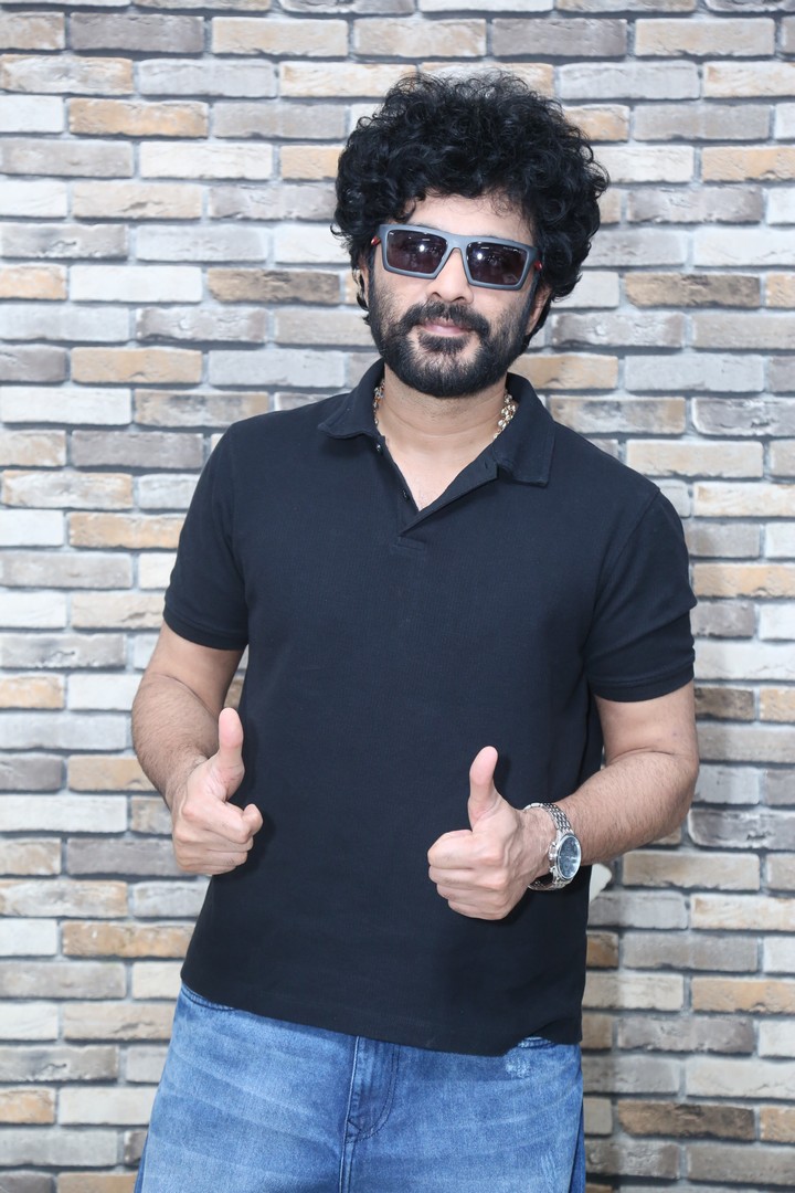 Siddu Jonnalagadda giving a confident thumbs-up in casual style