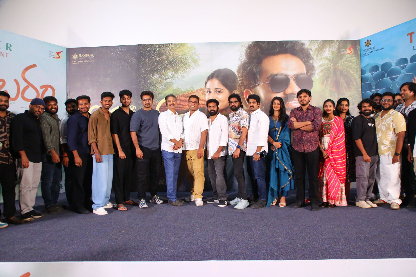 Film cast and crew posing at teaser event