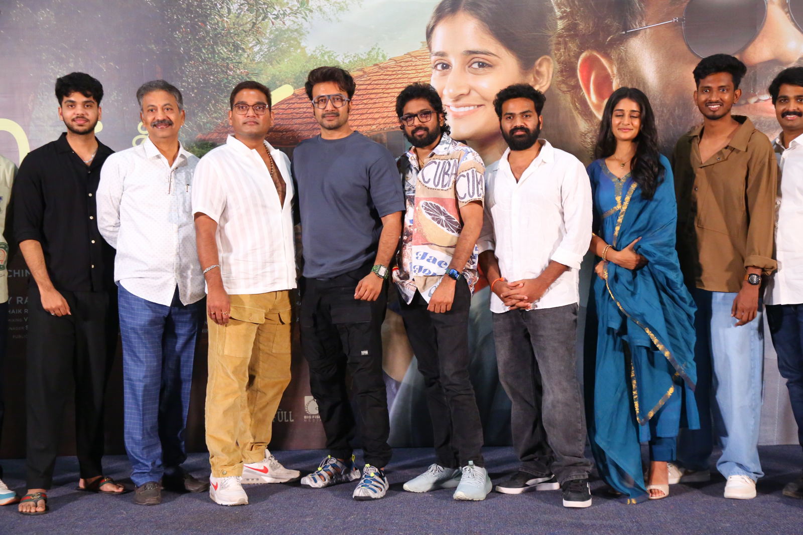 Film team celebrating on teaser event stage