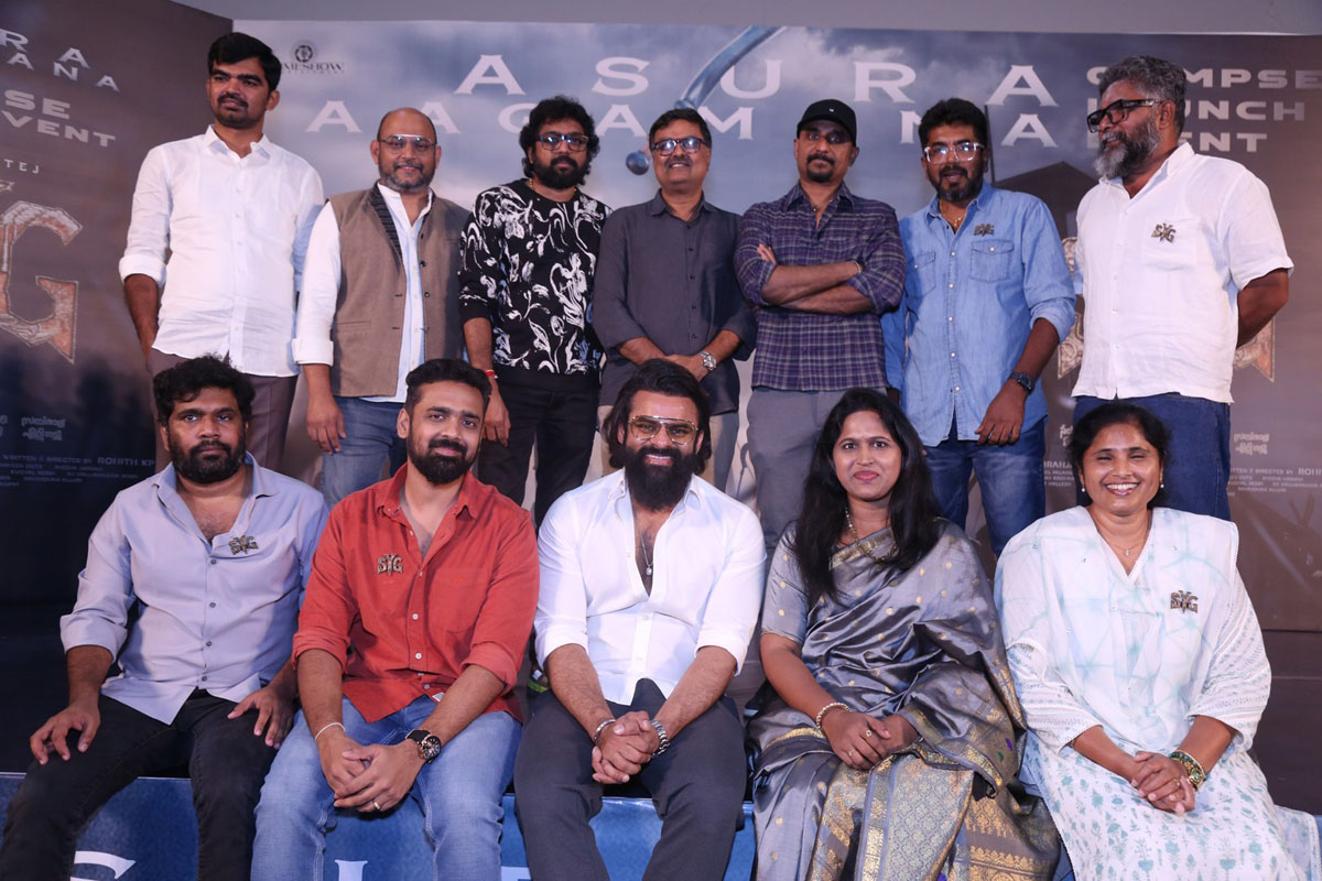 Film team standing and seated on stage during launch