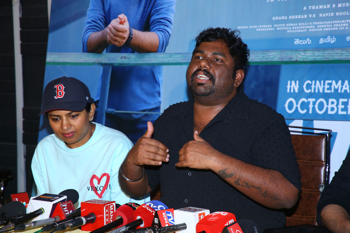 Harsha Chemudu responding to media questions at the event