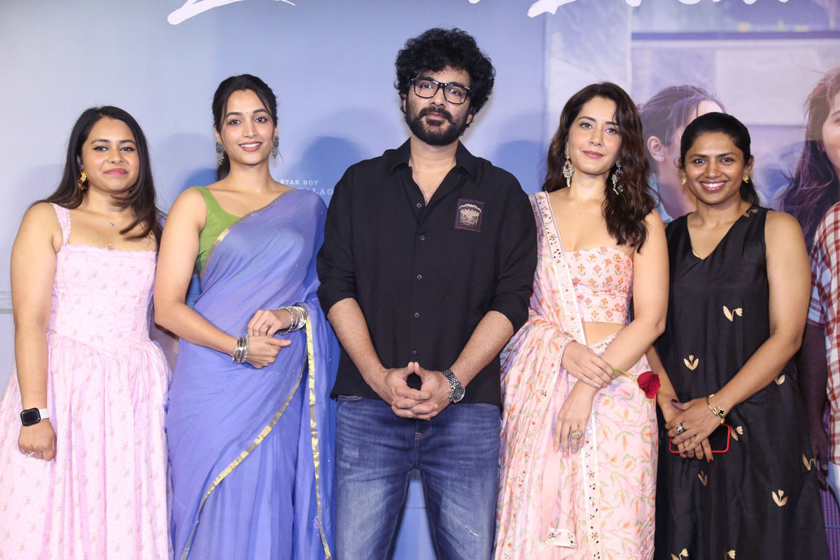 Cast and producer posing for media