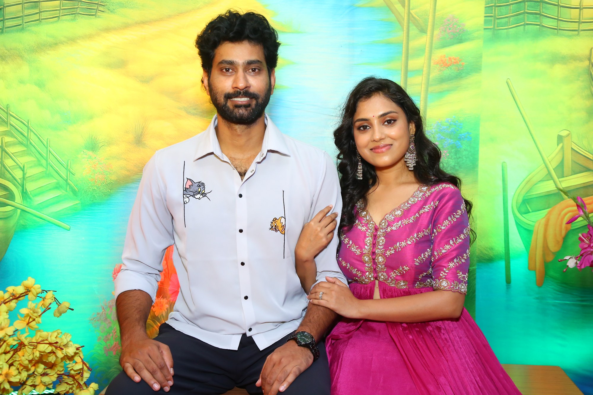 Thiruveer and Teena Sravya posing elegantly for media cameras
