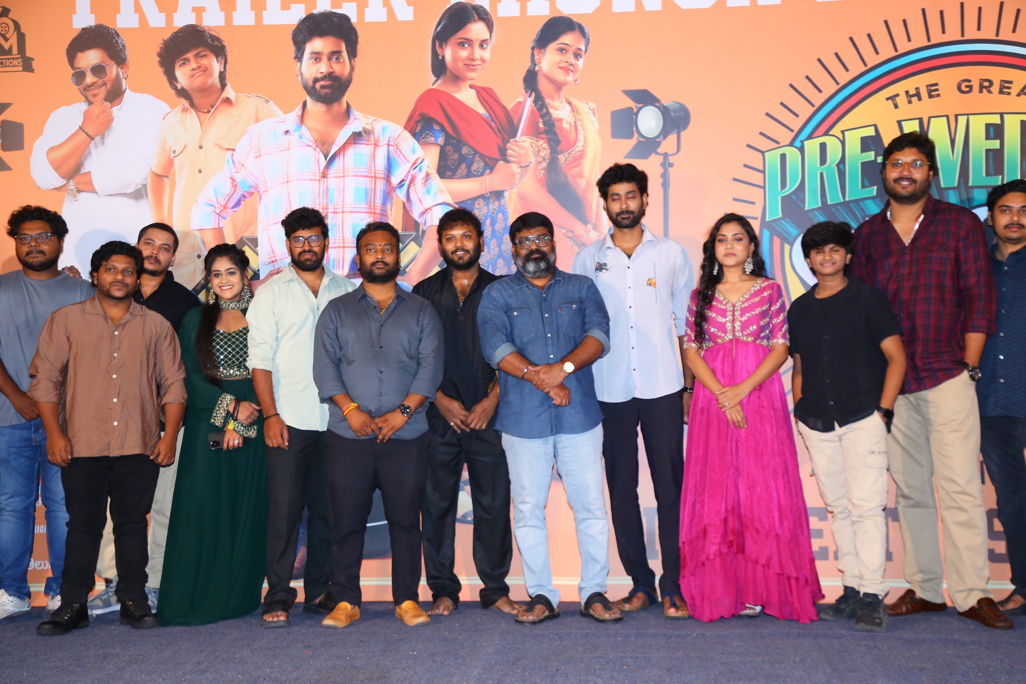 Star cast and crew posing together for group photo