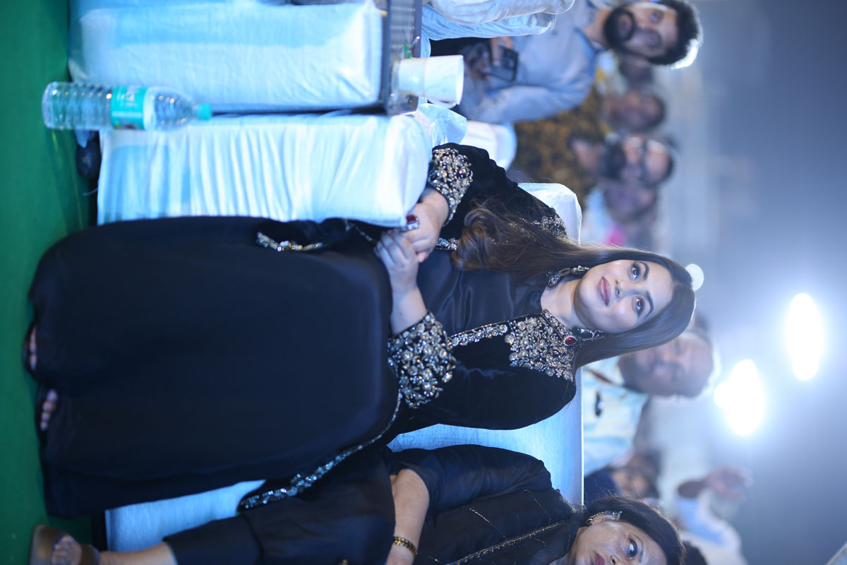 Actress Purna seated with cheerful smile