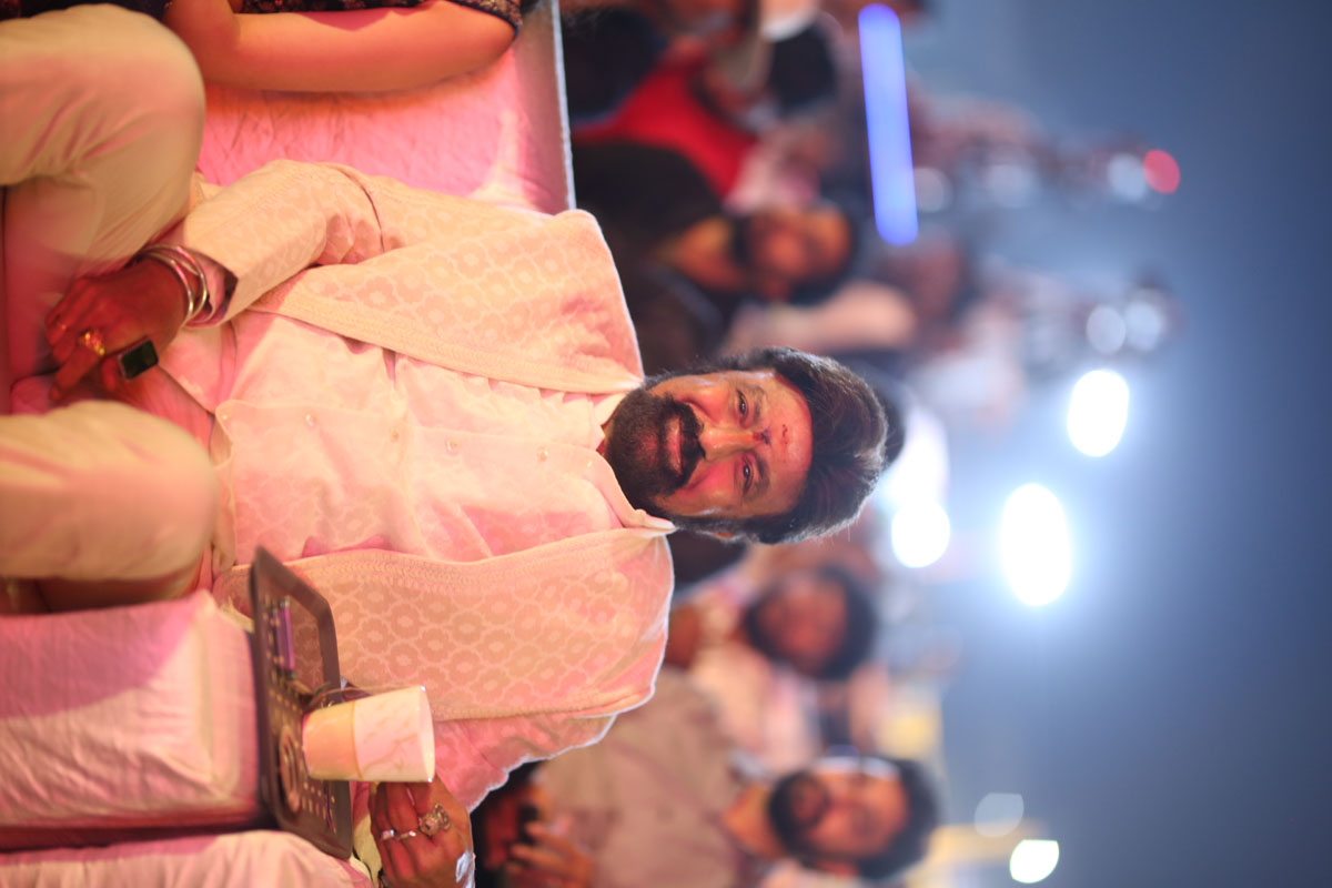 Balakrishna seated with warm smile