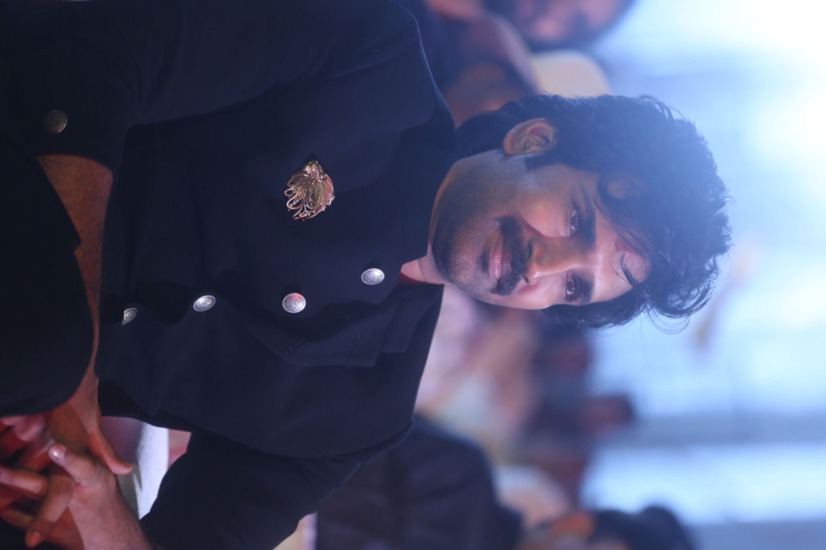 Aadhi Pinisetty seated and smiling