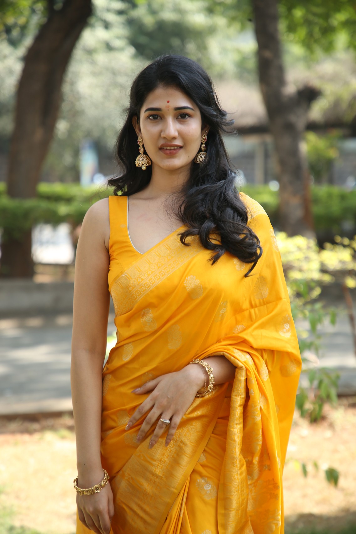 Amrutha Chowdary exuding grace in vibrant yellow saree