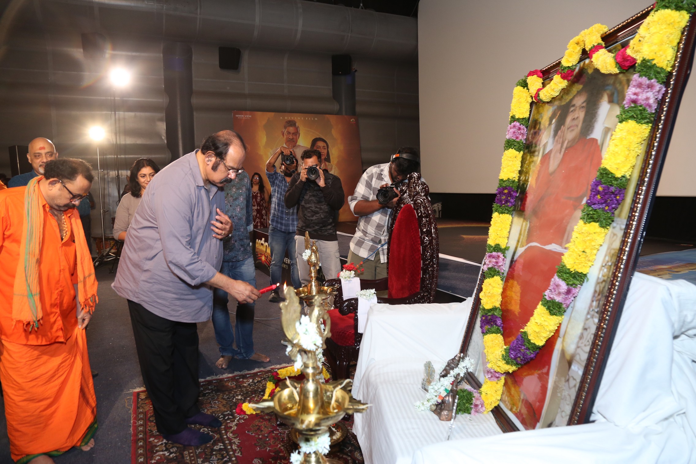 Suresh Krishna lighting ceremonial lamp