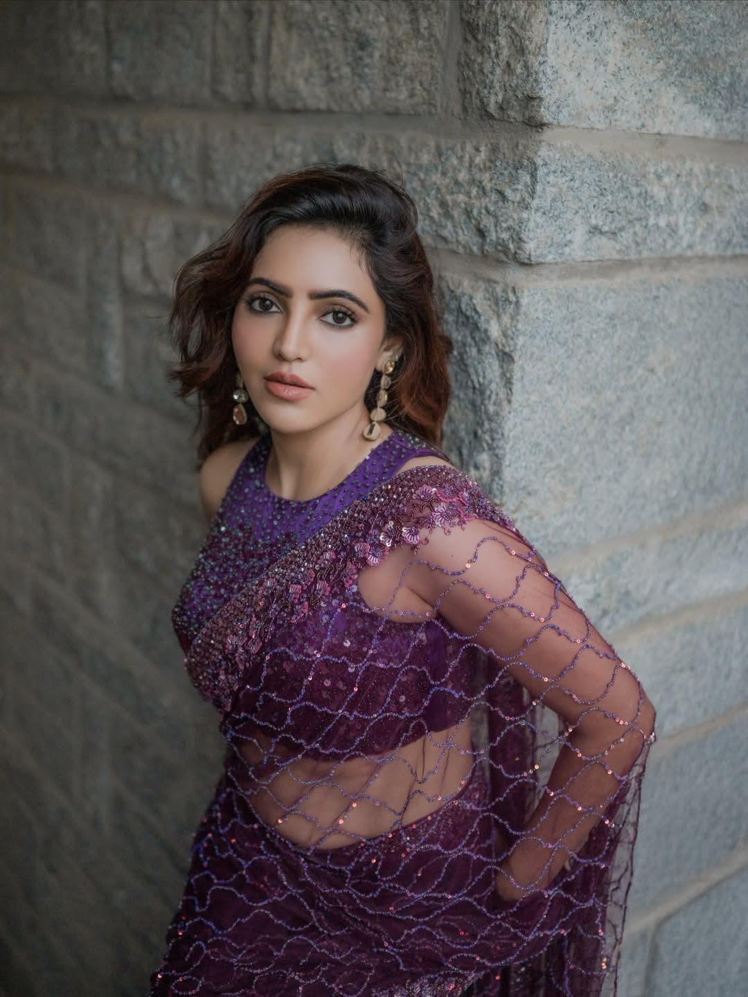 Athulya Ravi shining in elegant purple sparkle