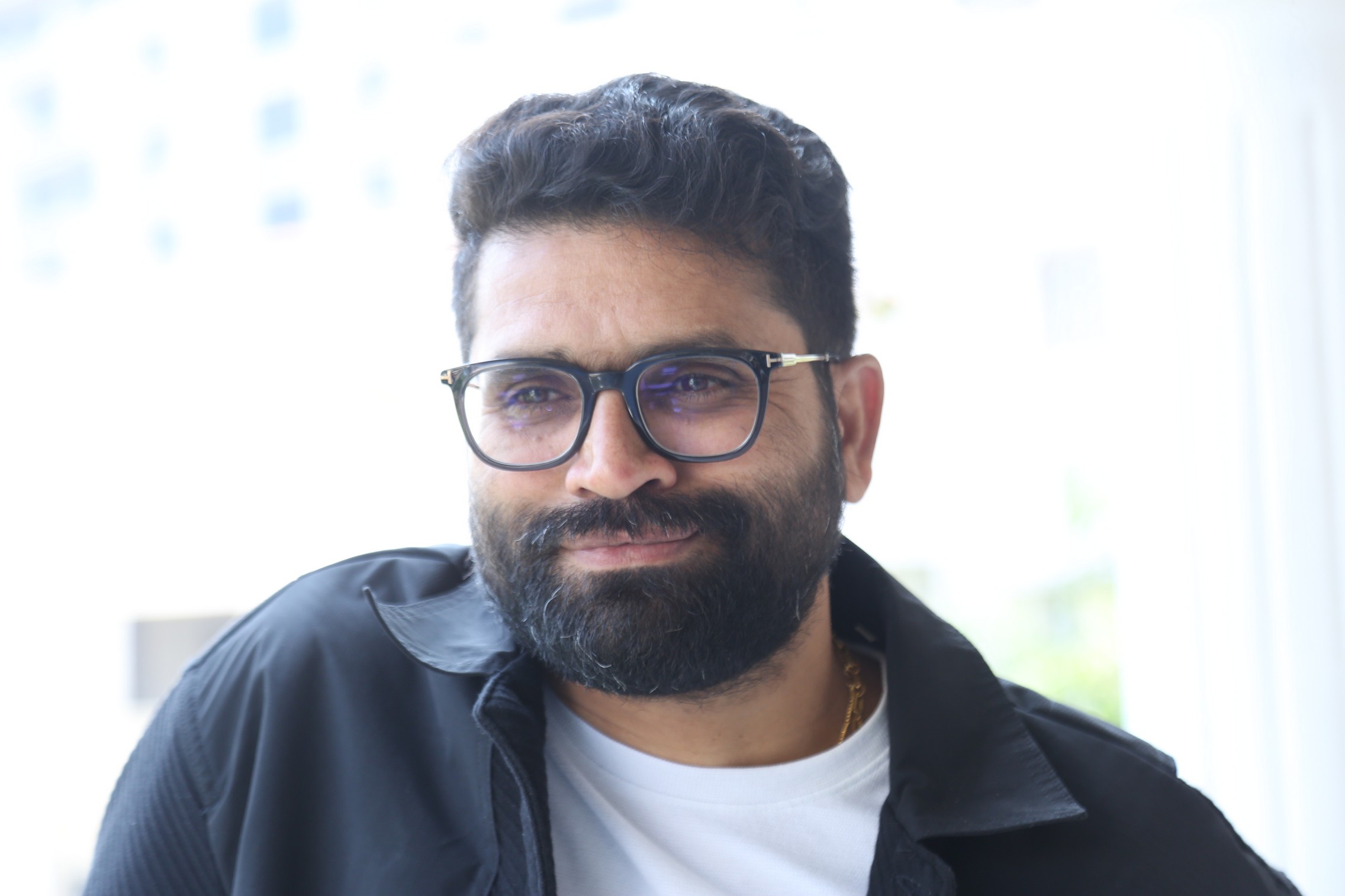 Bheems Ceciroleo showcasing charm with stylish glasses