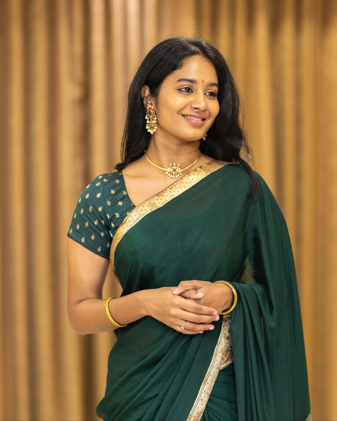 Brigida Saga stunning in rich green saree elegance