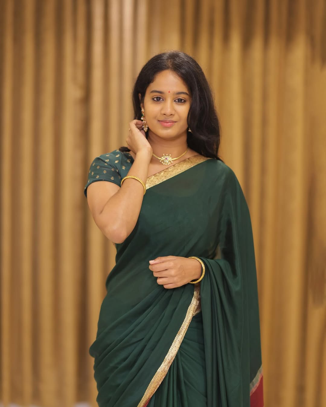 Brigida Saga traditional charm in classic green saree