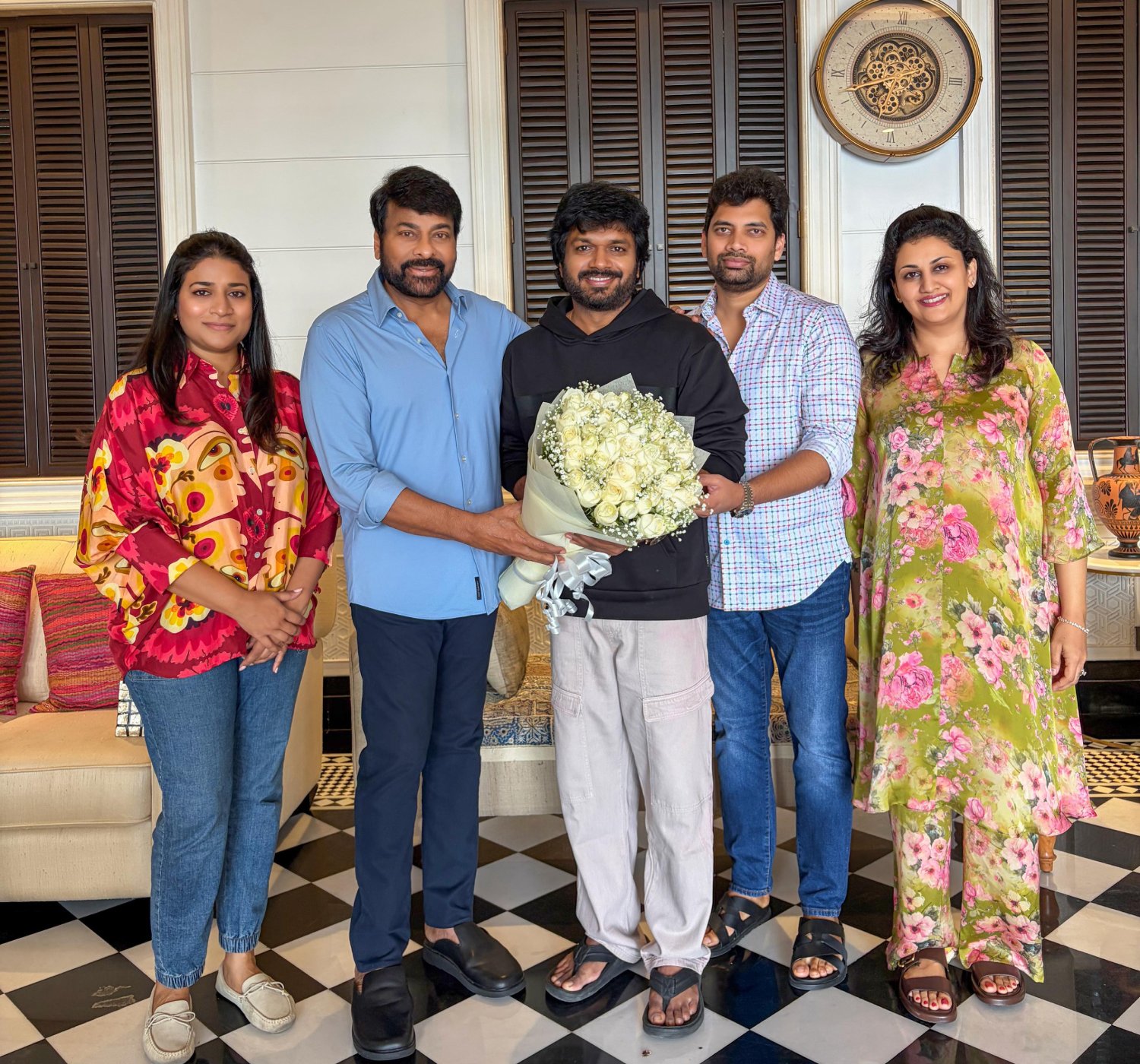 Smiling faces during a birthday gift exchange