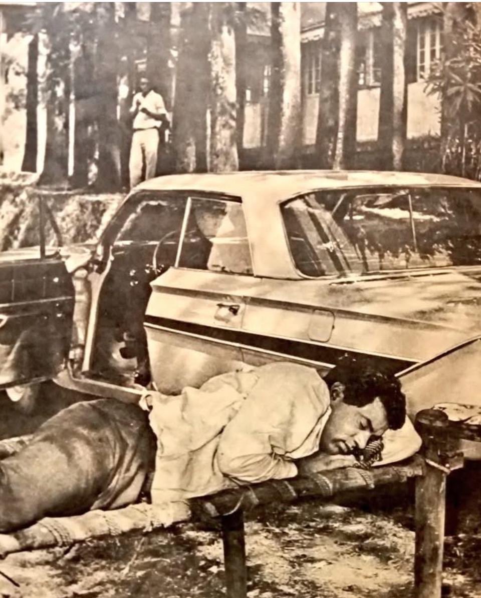 Dharmendra relaxing on cot with Impala car