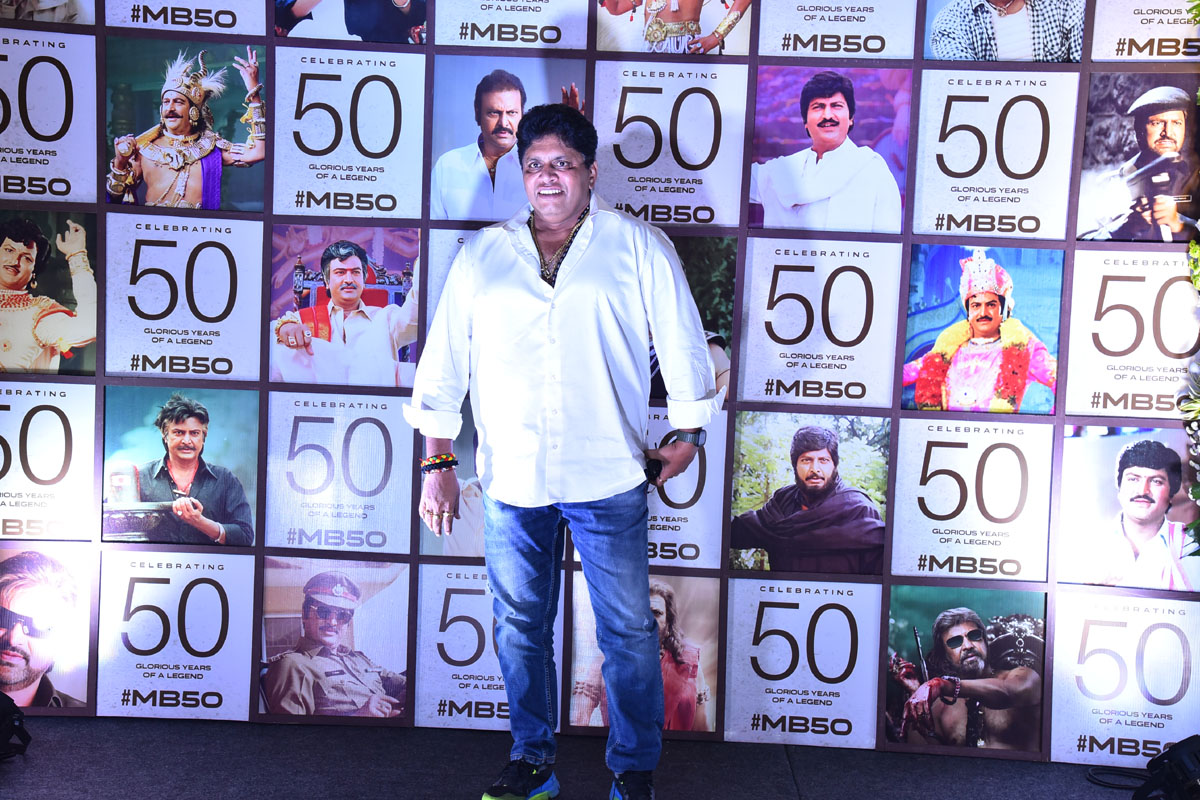 Raghu Karumanchi presenting a cheerful pose for the media.