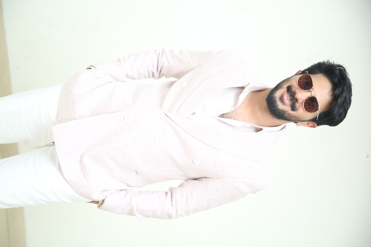 Dulquer Salmaan radiating charm and cool elegance in white