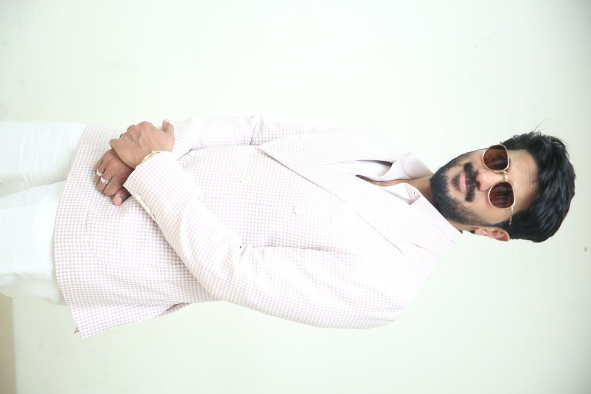 Dulquer Salmaan exuding sophistication in sharp suit and shades