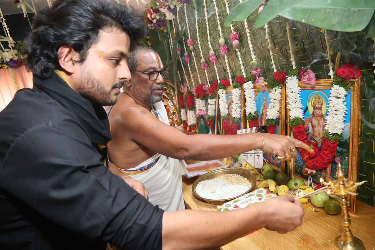 Trinadh Varma lighting diya during movie opening
