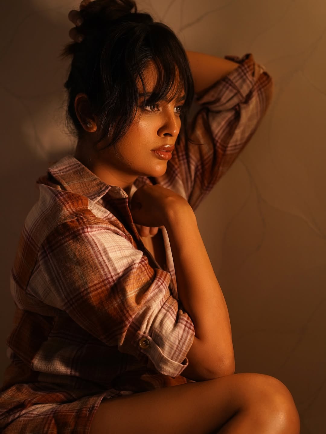 Nandita Swetha pairs cozy plaid with fierce elegance