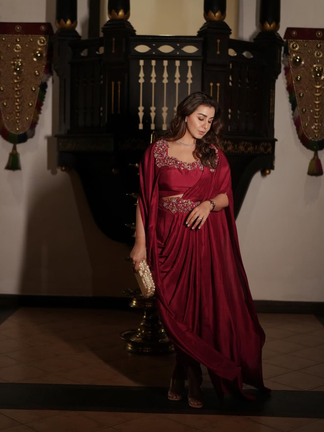 Nikki Galrani regal in maroon drape with poise