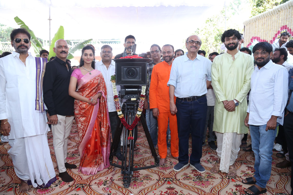 Film team posing with DOP and camera setup