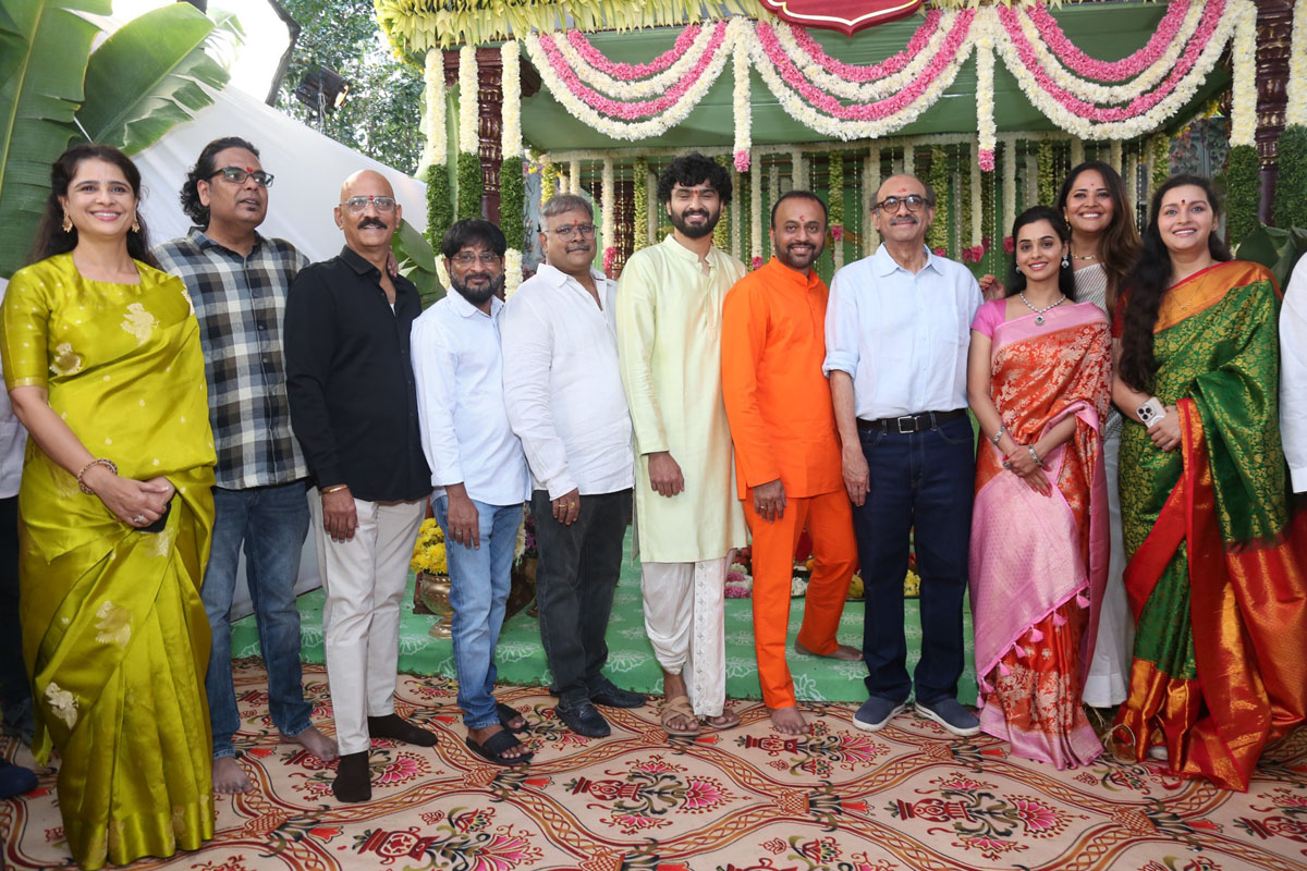 Cast and crew posing together at movie launch