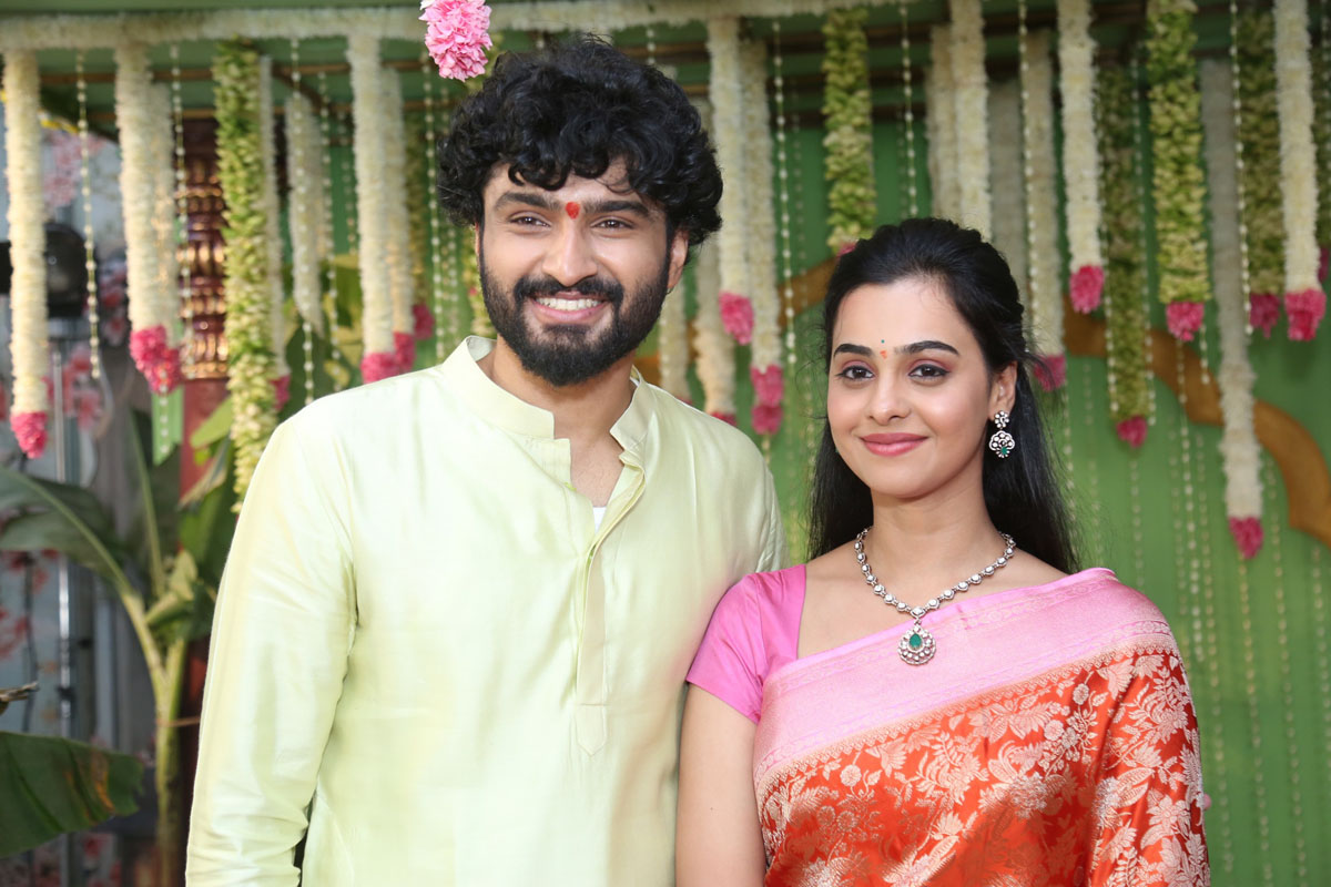 Lead pair posing together for media photos