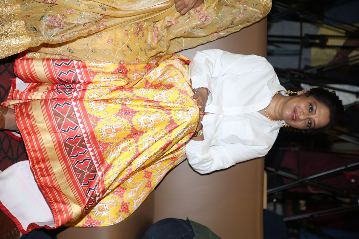 Anitha Chowdary seated at event