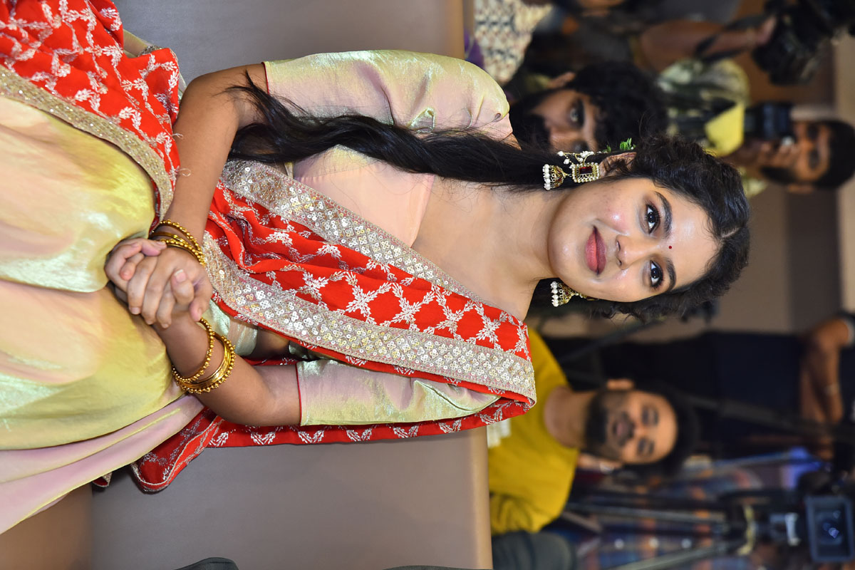 Tejaswi Rao seated smiling