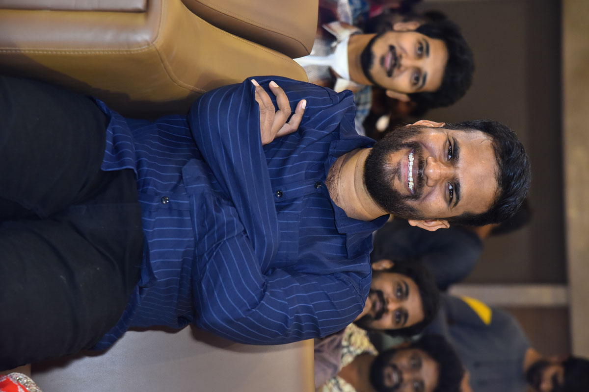 Saailu Kampati seated smiling