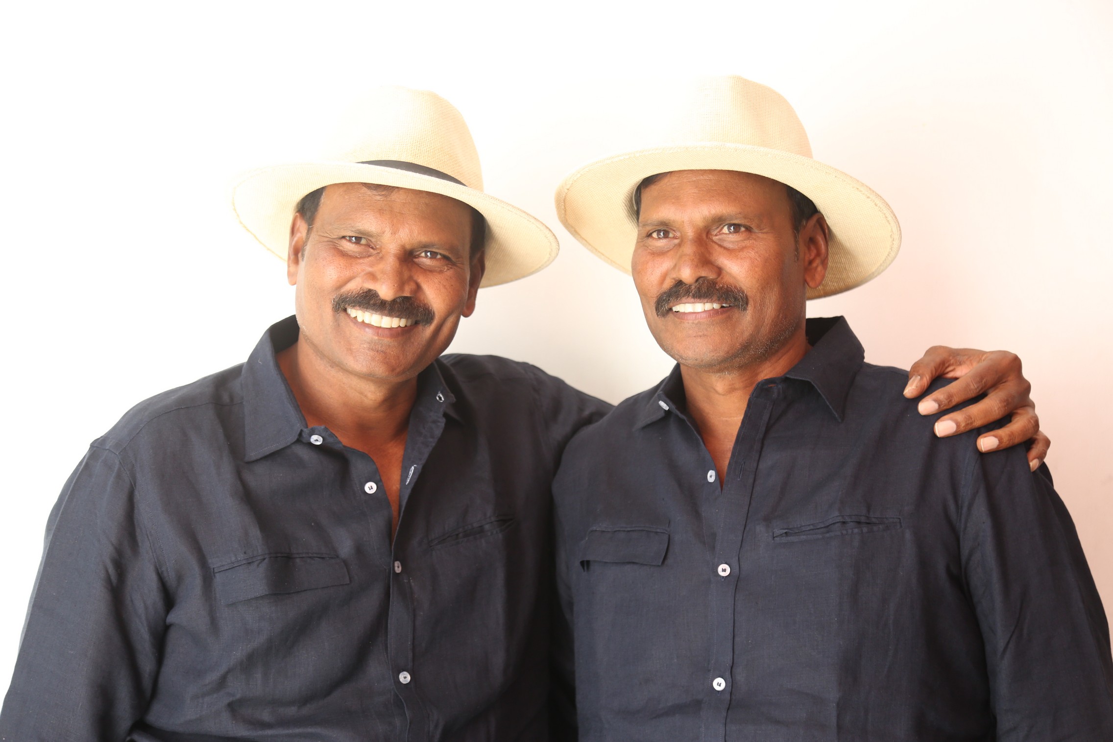 Ram Laxman showcasing matching hats with elegant charm