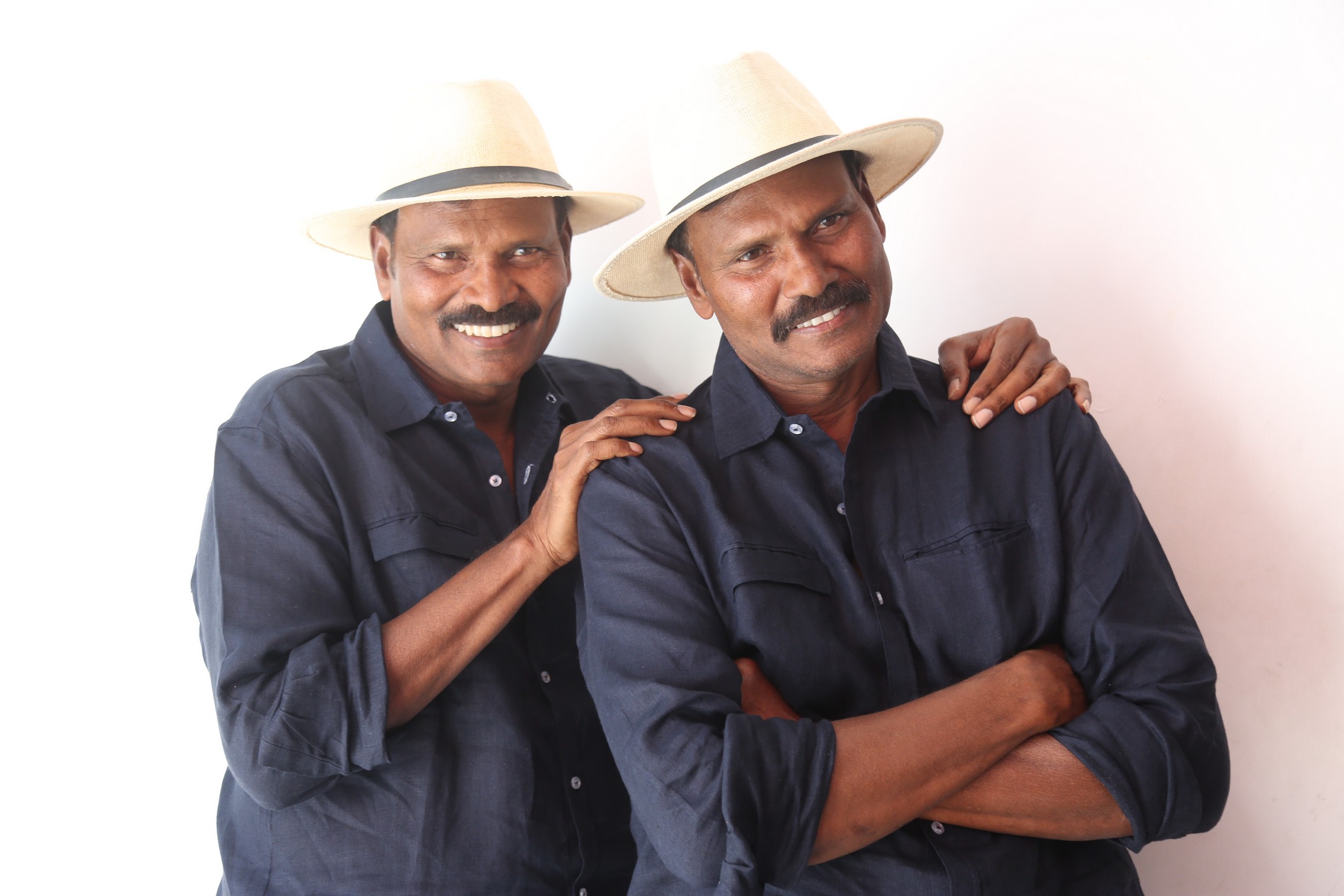 Ram Laxman smiling in coordinated hats and casual style