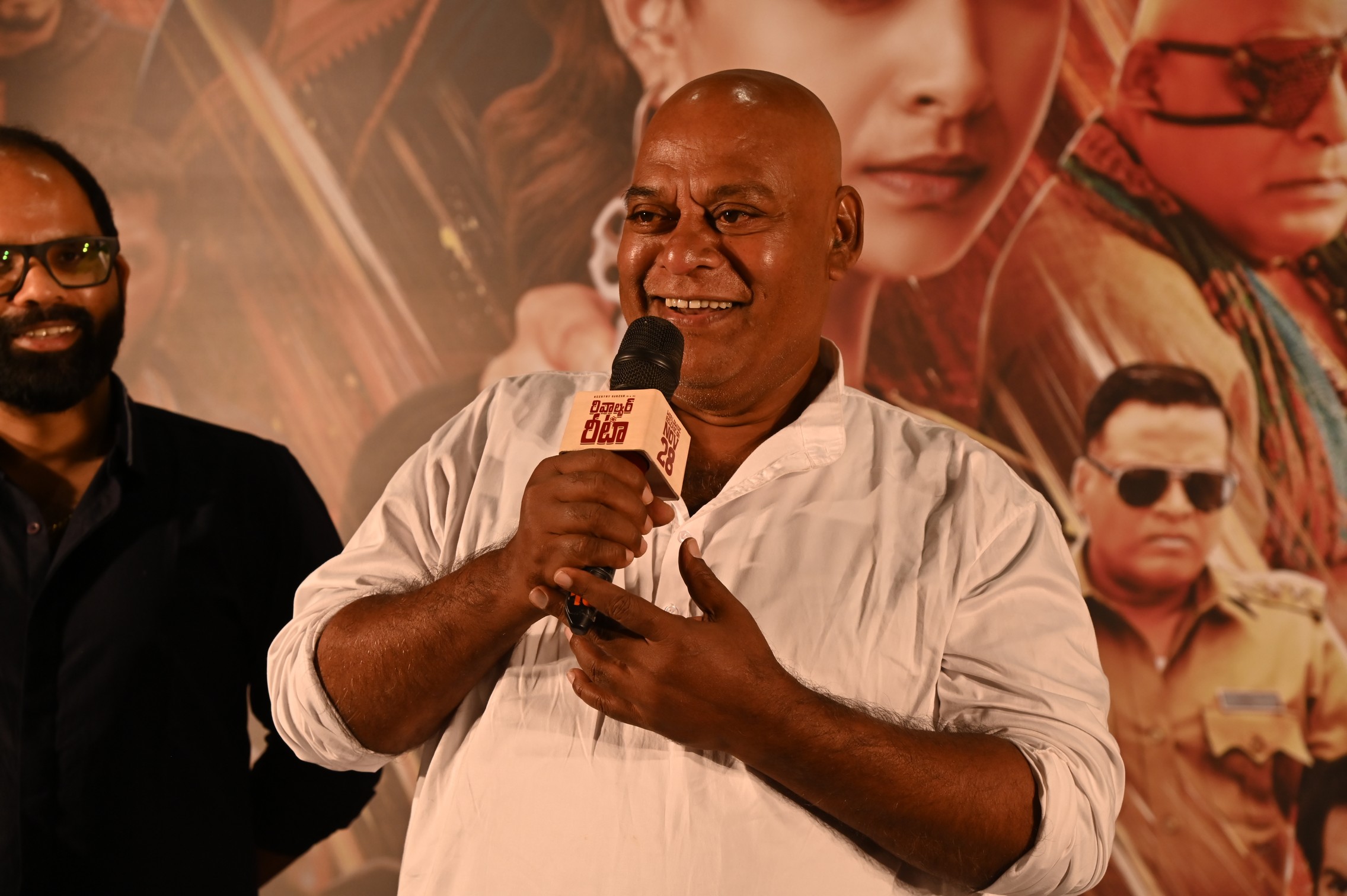 Ajay Ghosh speaking on stage