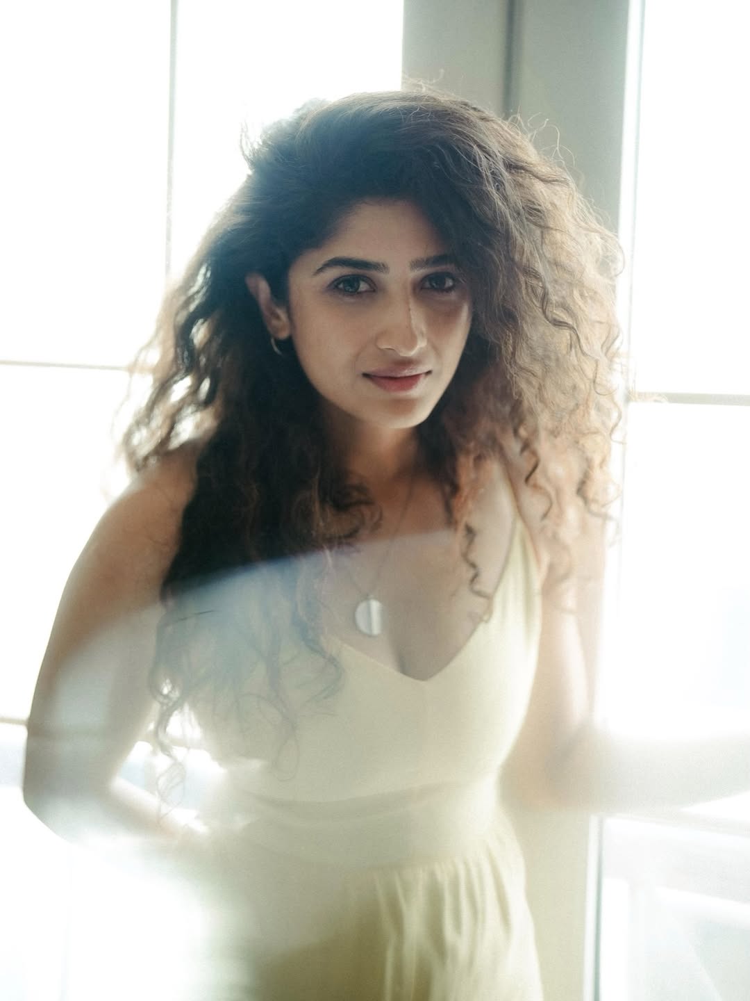 Roshini Prakash pairs fierce curls with a soft smile