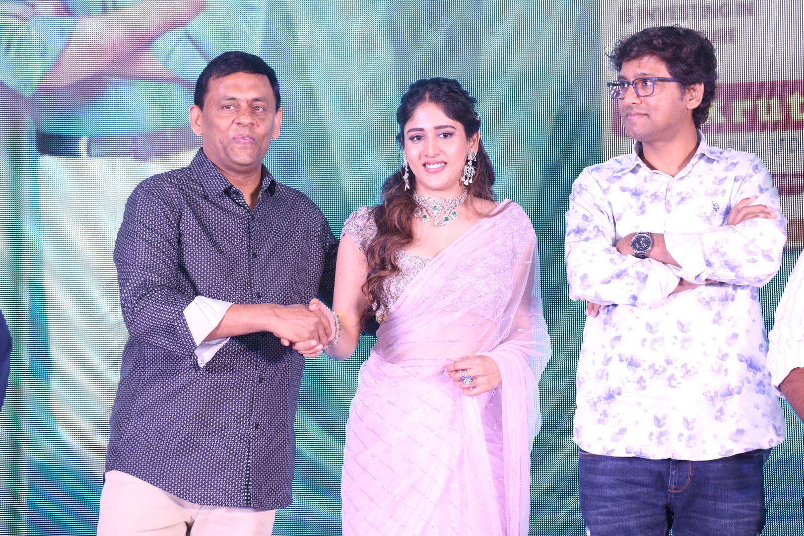 Nirvi Hariprasad Reddy shaking hands with Chandini Chowdary