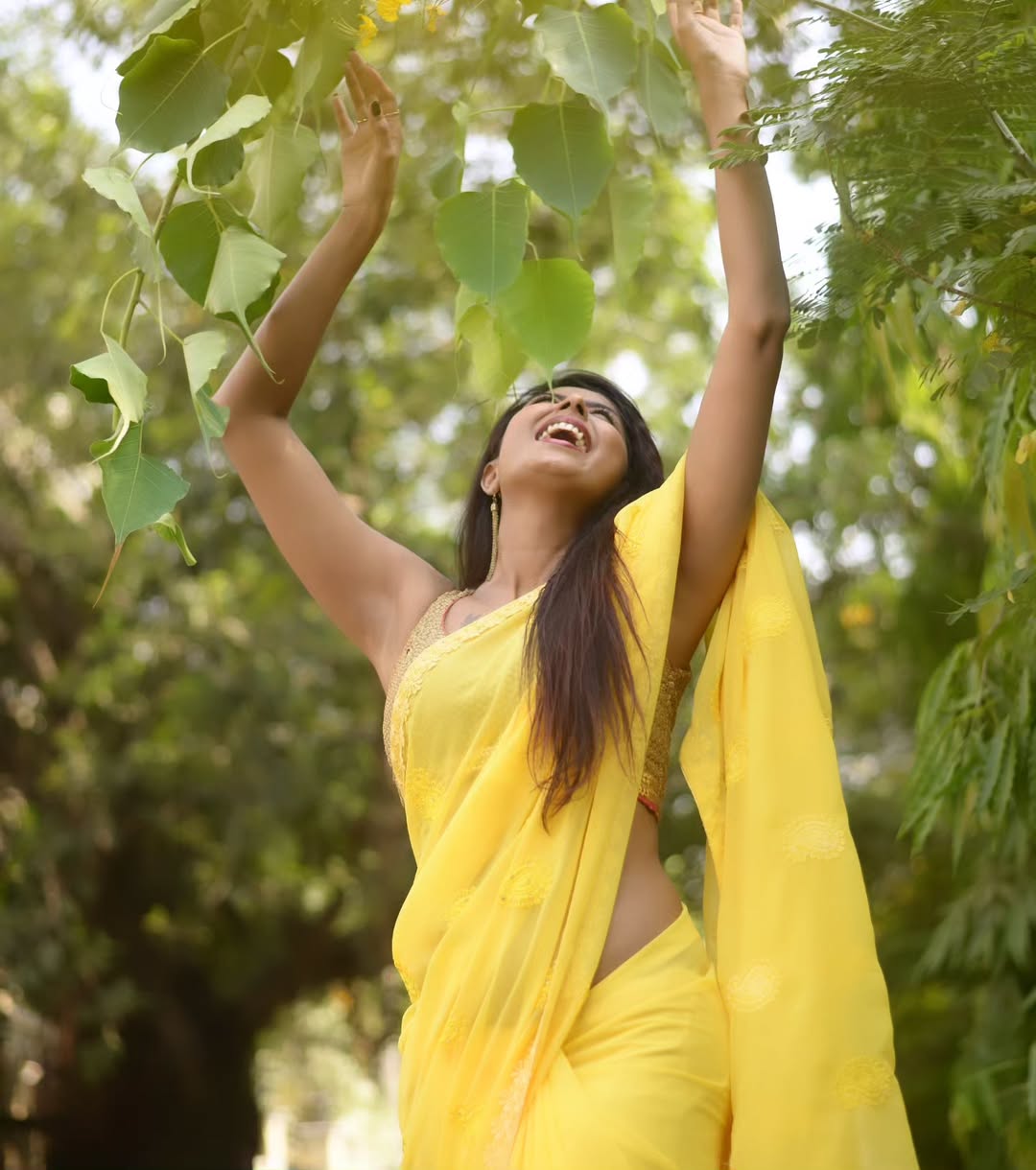 Shubha Raksha blending elegance with nature in yellow saree