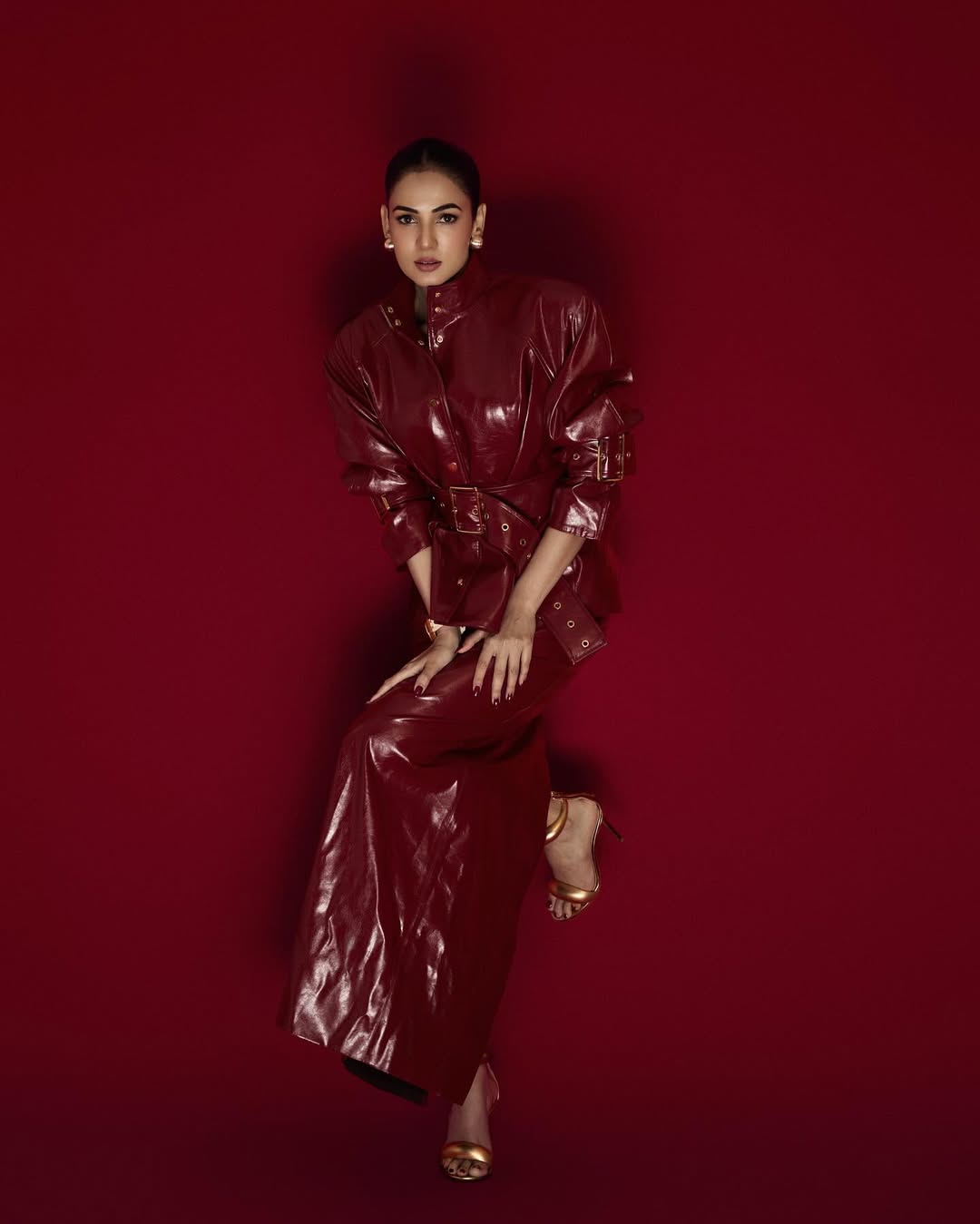 Sonal Chauhan posing in striking red leather attitude