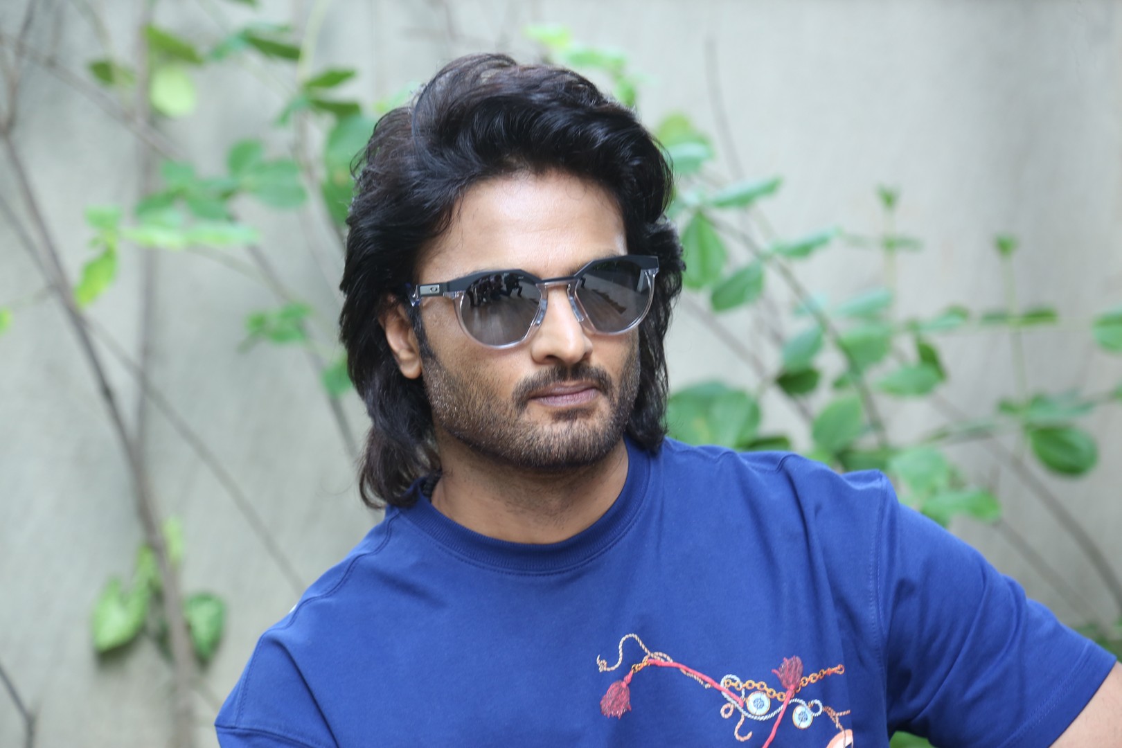 Sudheer Babu rocking shades and vibrant blue look