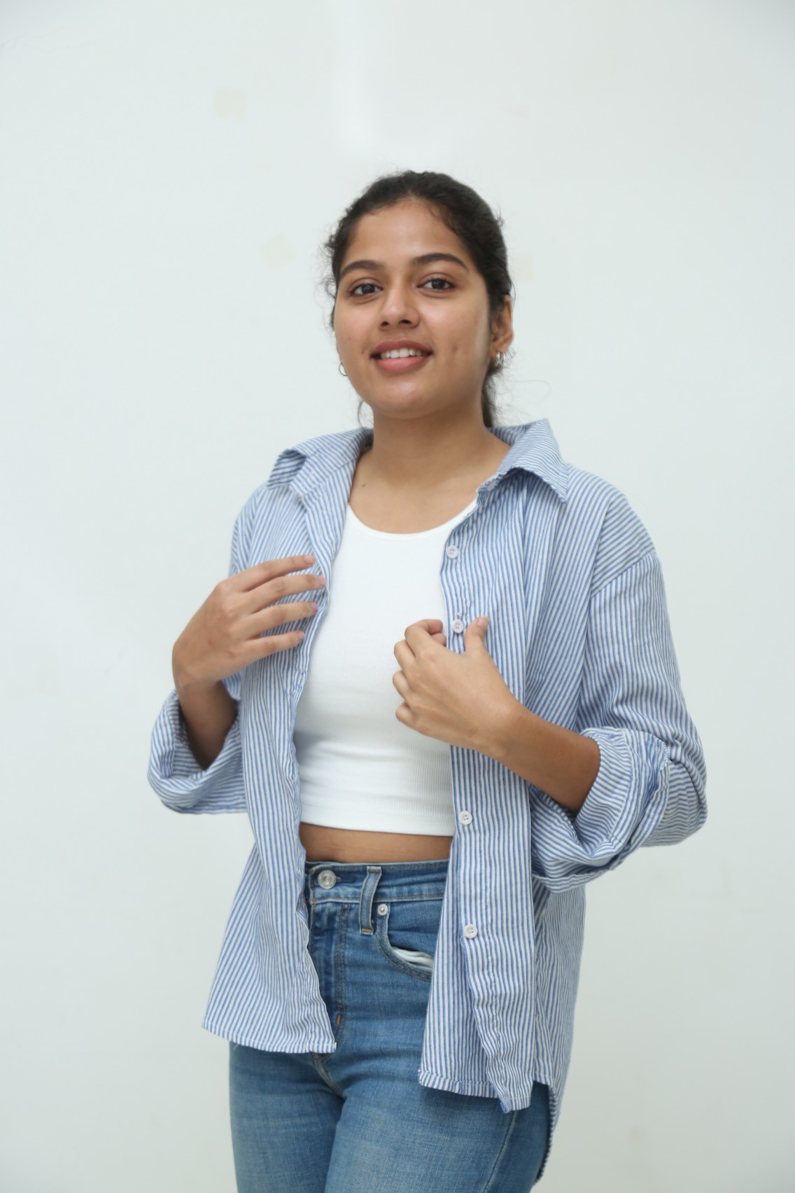 Tejaswi Rao in striped shirt stylish pose