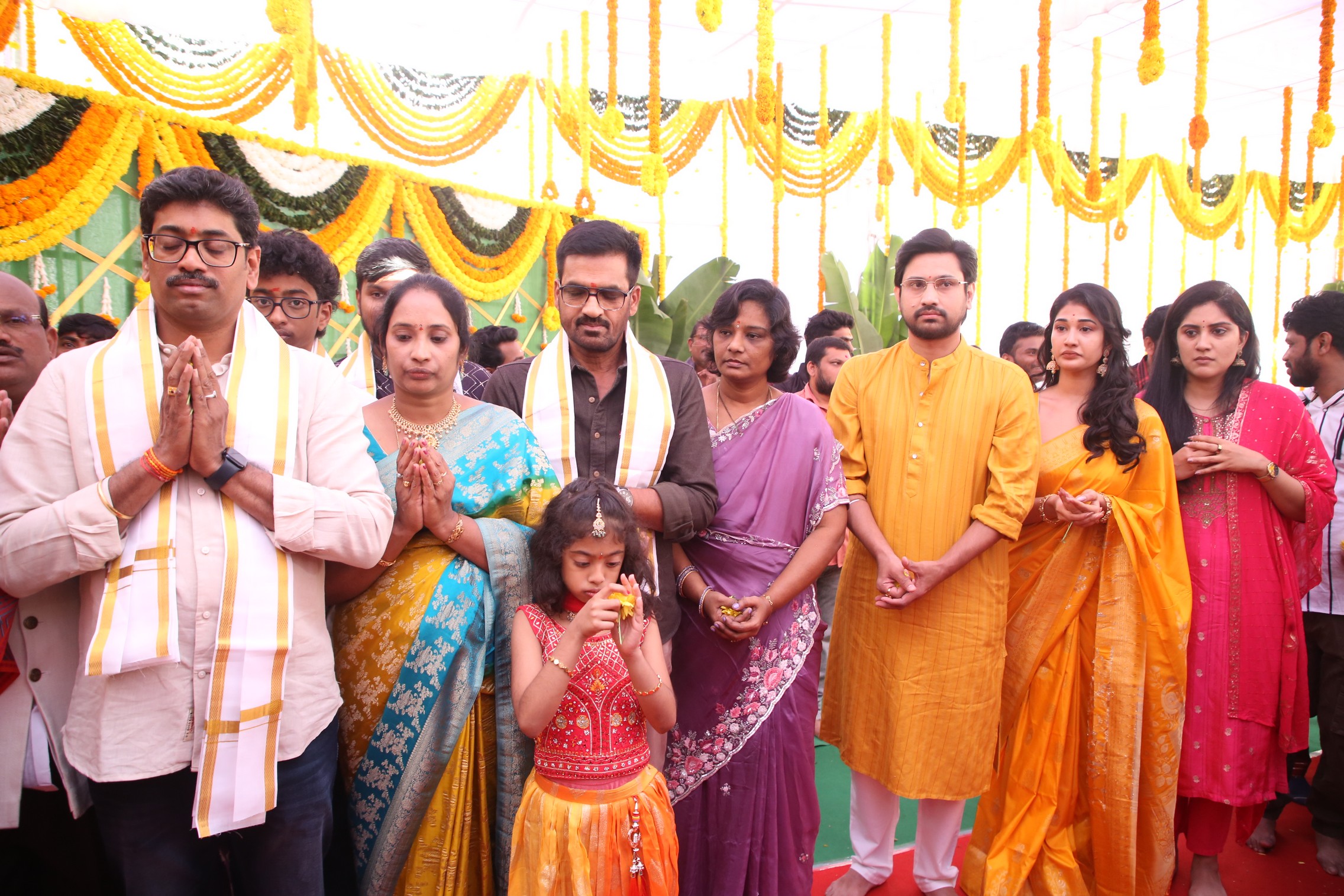 Team praying together at ceremonial event