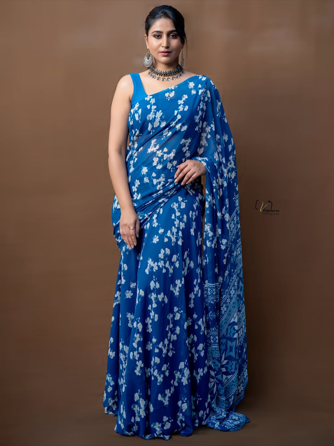 Varshini Sounderajan showcasing graceful style in blue floral saree