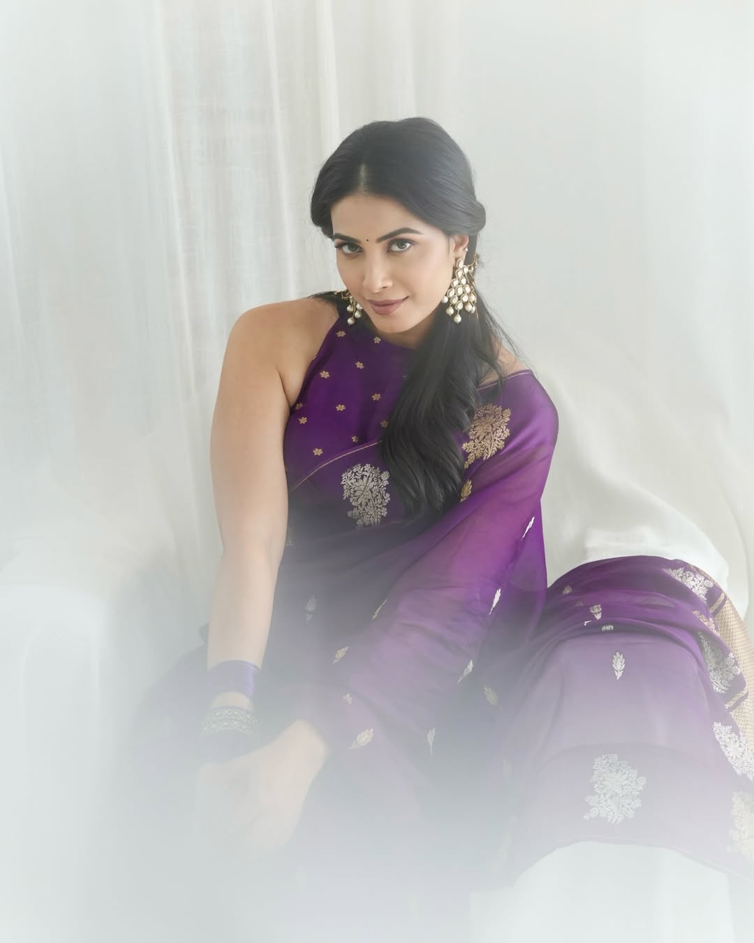 Kavya Shetty styled beautifully in purple saree attire