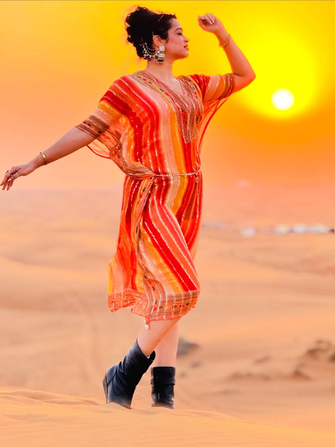 Apsara Rani posing boldly with desert sunset fashion