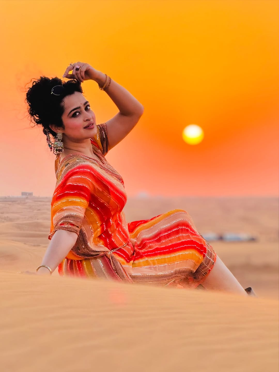 Apsara Rani showcasing vibrant style in sunset light